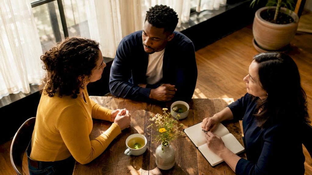 Young couple in premarital counseling session