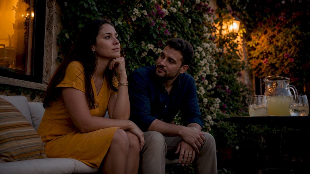 Couple having calm discussion on couch