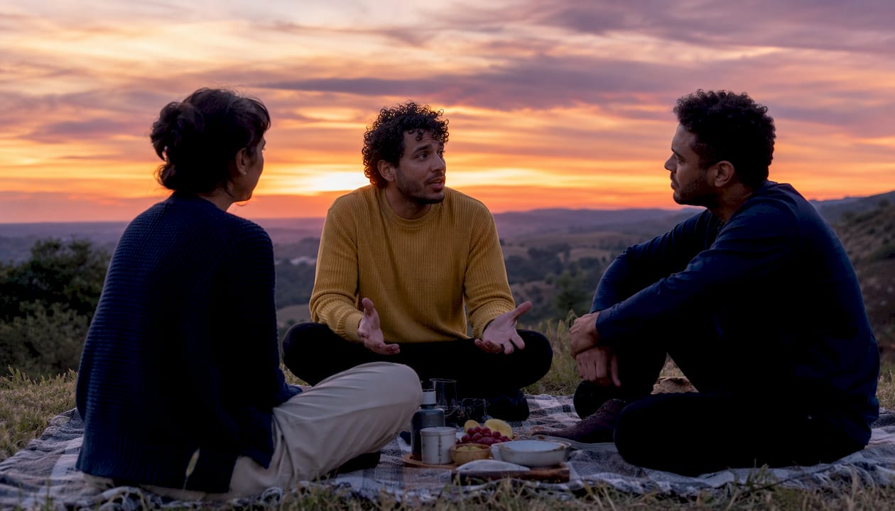 Friends having sincere emotional conversation outdoors