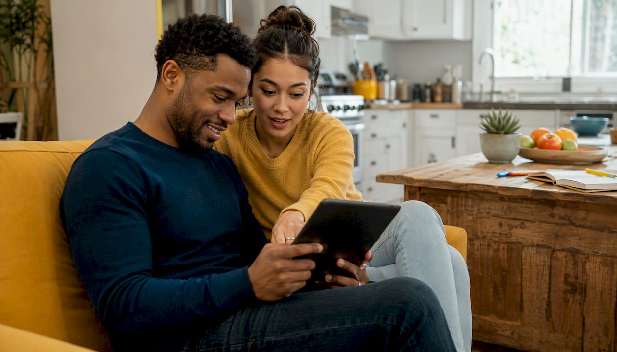 Couple using tablet for premarital education