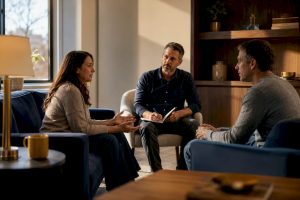 Christian counselor guiding a couple through conflict repair