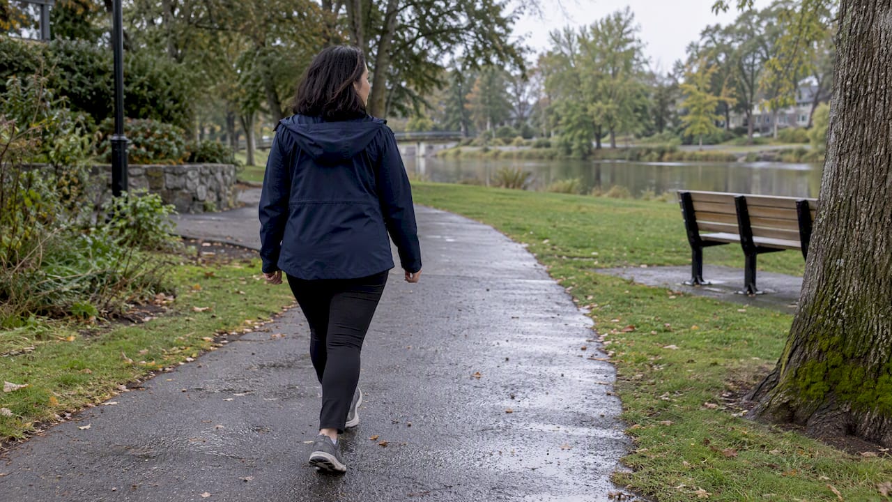 Woman taking a calm walk in a park