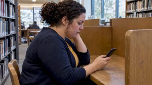 Woman privately searching for relationship safety support