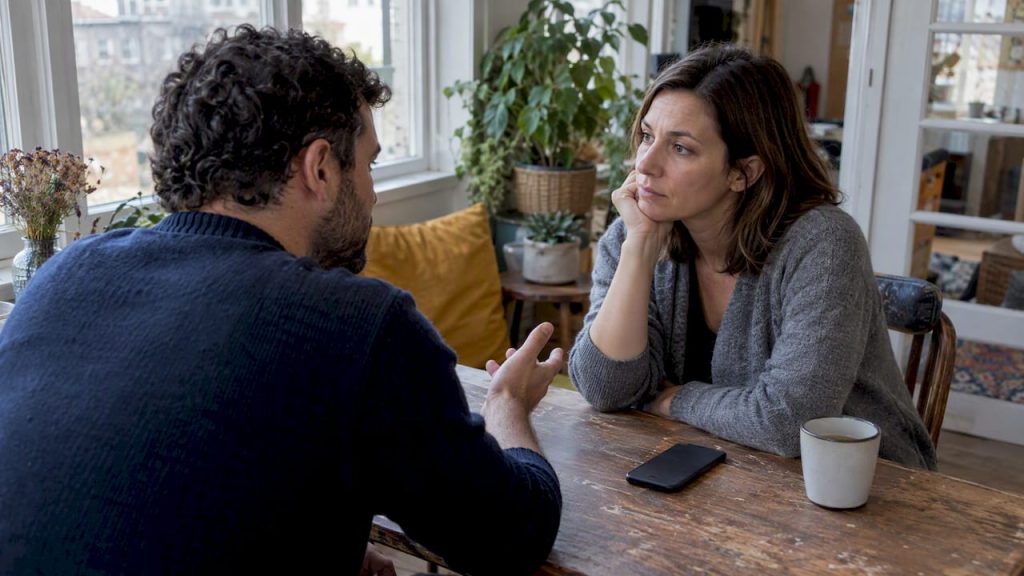 Spouses discussing a private message