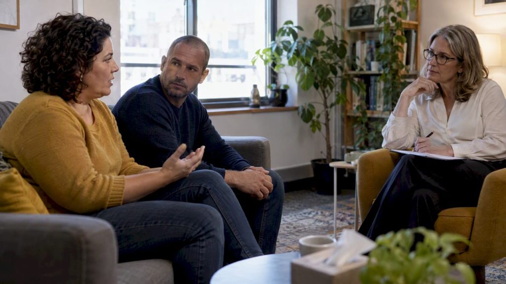 Therapist listening to a couple in session