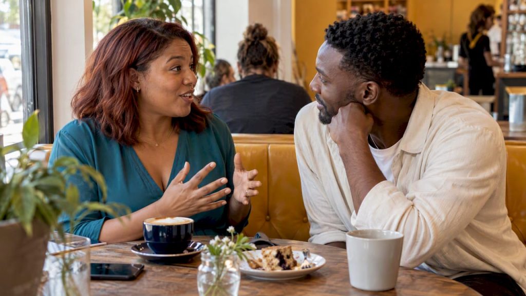 Partner listens as woman shares exciting news