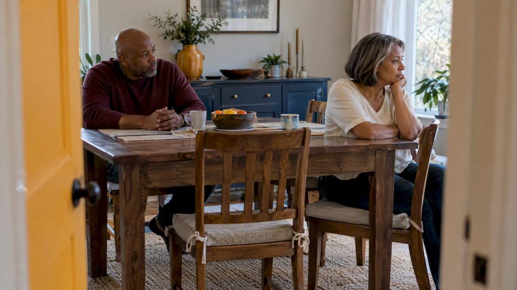 Spouses sit apart in unresolved silence
